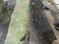 A power washer cleans a driveway, showing a clear difference between the dirty, green-stained section and the freshly cleaned area. Text at the bottom reads, Durning job.